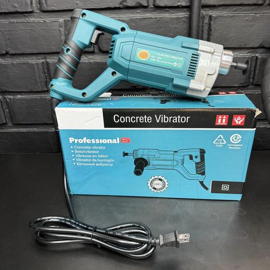 Vibrador de concreto STONE TOOLS 1200W sobre su caja, visto de perfil